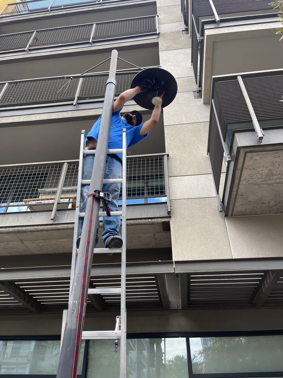 Exterior LED pole light replacement at a downtown Phoenix property by Thunderbird Electric Home Services